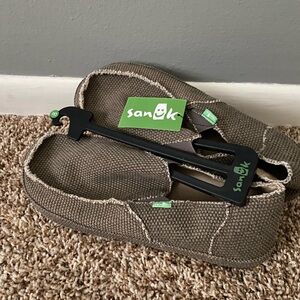 Men’s Sanuk slip on shoes.  Size 8